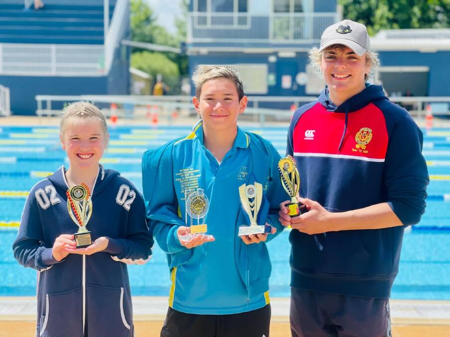 WELL DONE: Orange Aquatic Club members Abby Williams, Kingston Johnston and Dylan Crisp were each crowned age champions. 