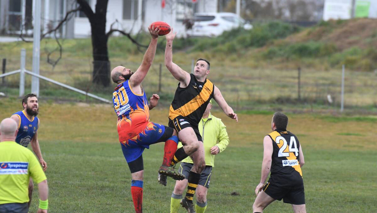 ON THE HUNT: Callan Hunt (Tigers) goes up against Dubbo's Tom Skinner. Photo: JUDE KEOGH