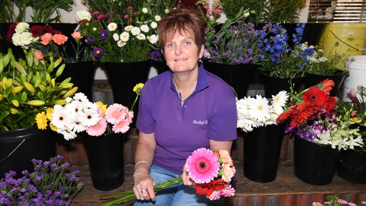 WELL-EARNED: Sally Wright from Bradley's Florist is retiring next month after 21 years in the business. Photo; CARLA FREEDMAN.