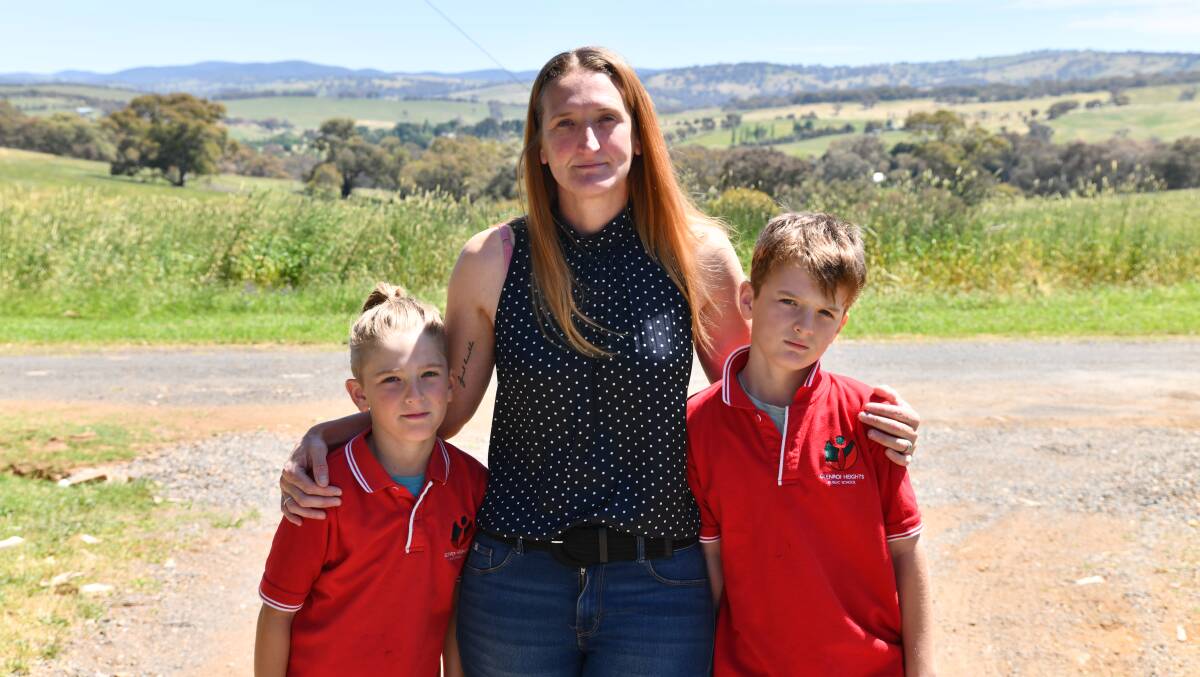 Dax, Rachel and Mason Clarke were all left devestated following a fire at Glenroi heights Public School. Picture by Carla Freedman.