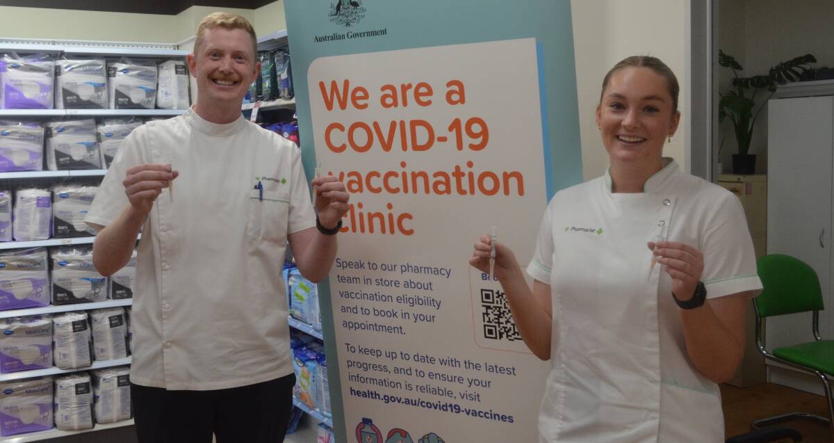 BOOKING TIME: Jack Buckley and Georgia Campbell from McCarthy's Pharmacy are hoping to see an uptick in flu vaccinations. Photo: RILEY KRAUSE.