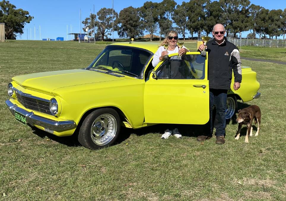 LOOKING GOOD: Sharnie Phillips with her Holden EH Ol Del and Sam Connell, Field Days chairman and Skip the dog. Photo: SUPPLIED.
