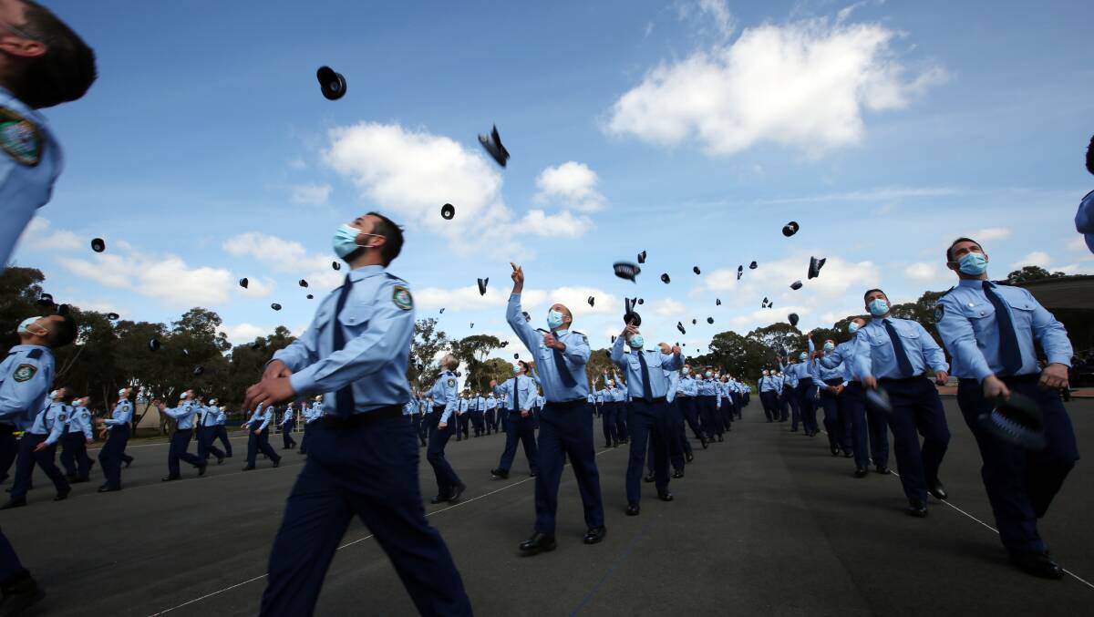 WELCOME ABOARD: New police recruits celebrate graduating. Photo: NSW POLICE FORCE.