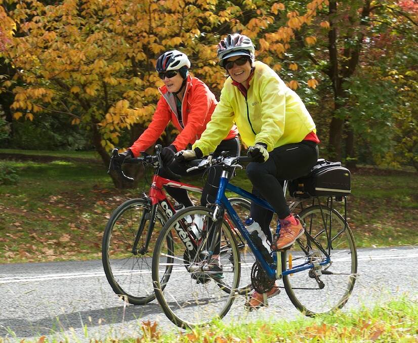 EXCITED: Bronwyn Asquith and Rosemary Morgan enjoying a ride around Orange during their trip from Canberra. Photo: HELMUT BERNDT.