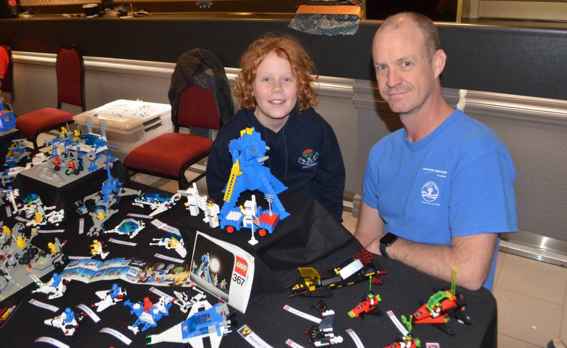 Liam and Matt Scott at the Ex-Services' Club with their space-age Lego display. Photo: RILEY KRAUSE.