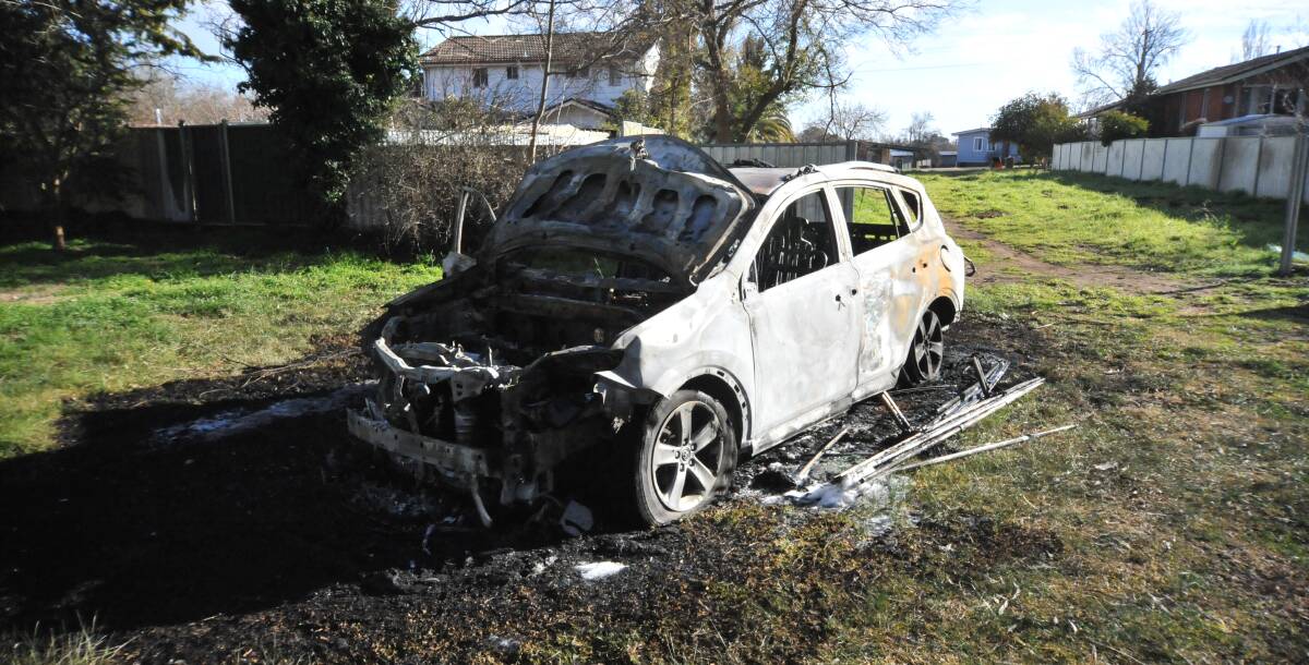 DESTROYED: The car that was set on fire in Edye Park on Monday morning. Photo: CARLA FREEDMAN