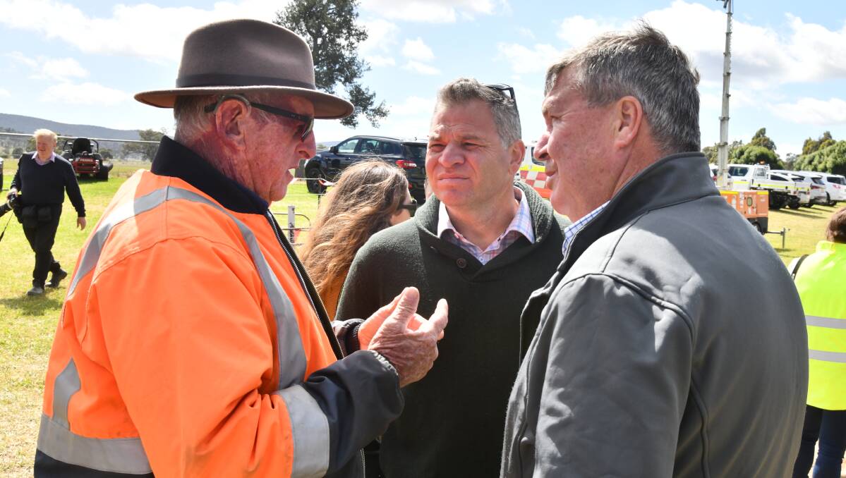 Eugowra resident Tony Toohey talking to Member for Orange Phil Donato and Cabonne Mayor Kevin Beatty on Tuesday. Picture by Carla Freedman.