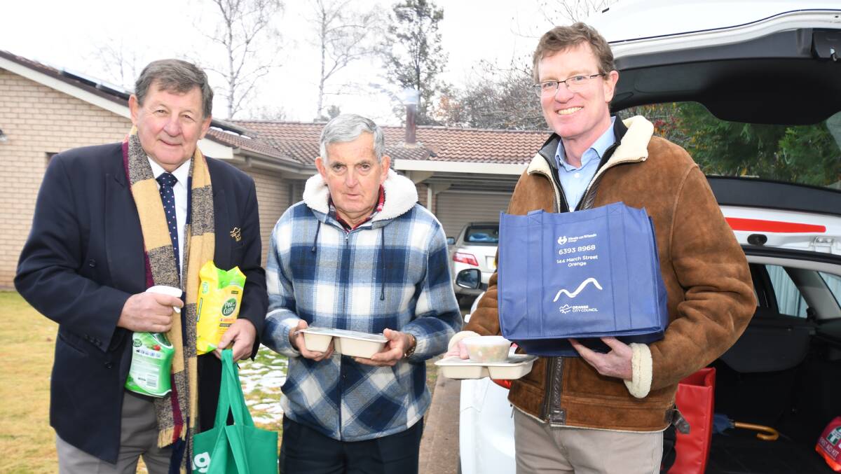 BIG BOOST: Orange mayor Reg Kidd, Meals on Wheels client Ray Martin and MP Andrew Gee. Photo: JUDE KEOGH.