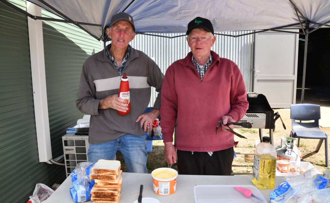 Orange Emulators Clive Walker and Steve Quilty were providing sausage sandwiches to many a hungry person on Tuesday. Picture by Riley Krause. 
