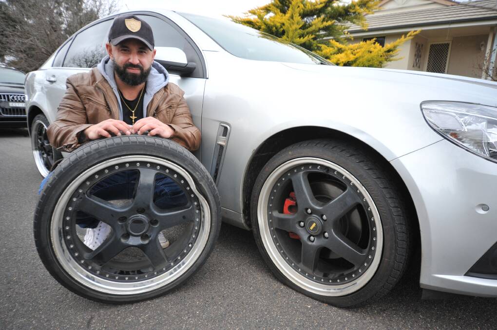 ANNOYED: Two of James Doueihi's tyres were popped when he hit the pothole in Anson Street. Photo: CARLA FREEDMAN.