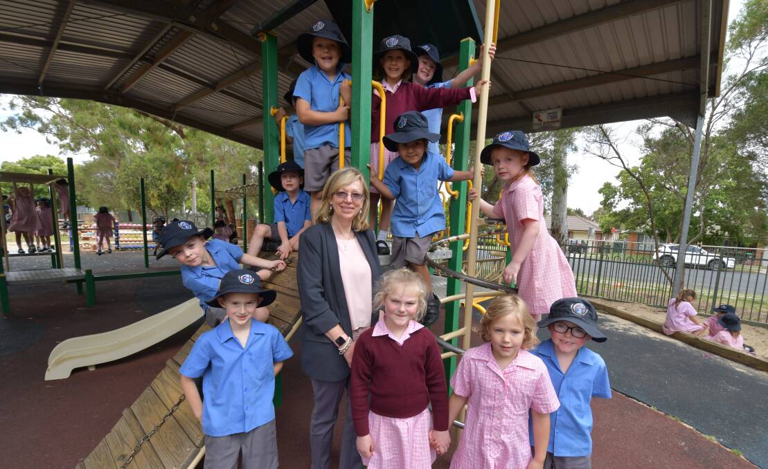 FAREWELL: Mrs Kerry Maher surrounded by Riley Harris, Charlie Redding, Otterly Graystone, Rhys Thomas, Gurfateh Virk, Payton Newham, Matthew McGovern, Sonny Venner, Elina Taylor, Maddison Atkinson and Jack Howarth. JUDE KEOGH.