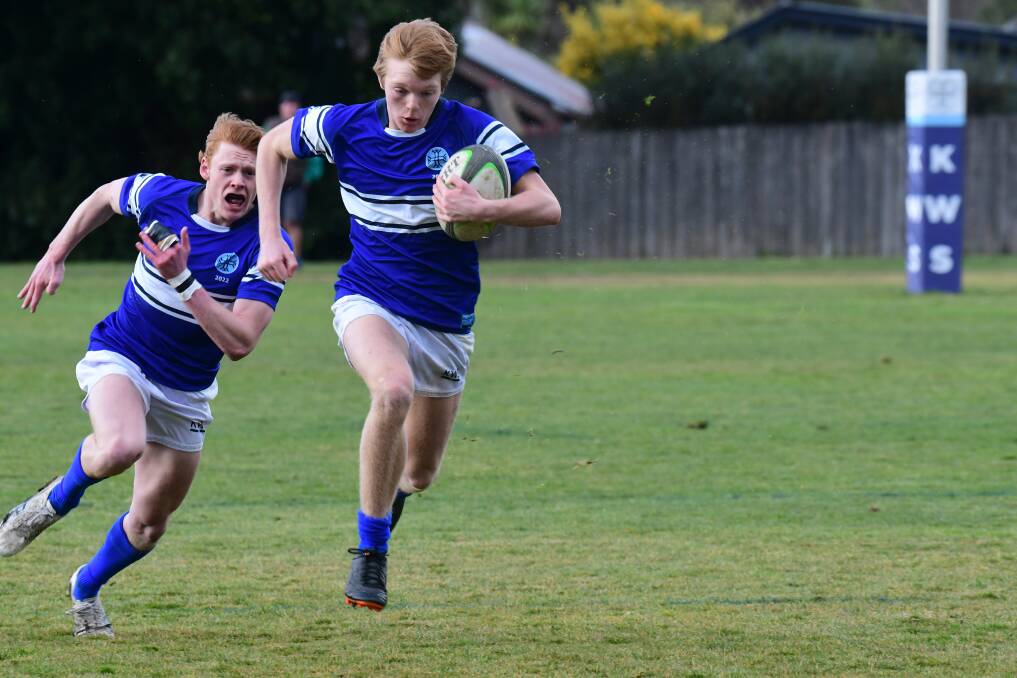 HARD FOUGHT: Jono Rasmussen and Jamie Anderson in action for Kinross in their First XV match against St Stanislaus' College. Photo: JUDE KEOGH.