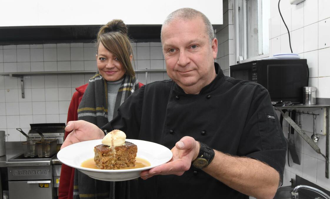 DELICIOUS: Kellie Chapman and Tony Van Loon with his popular Sticky Date Pudding. Photo: MARK LOGAN.