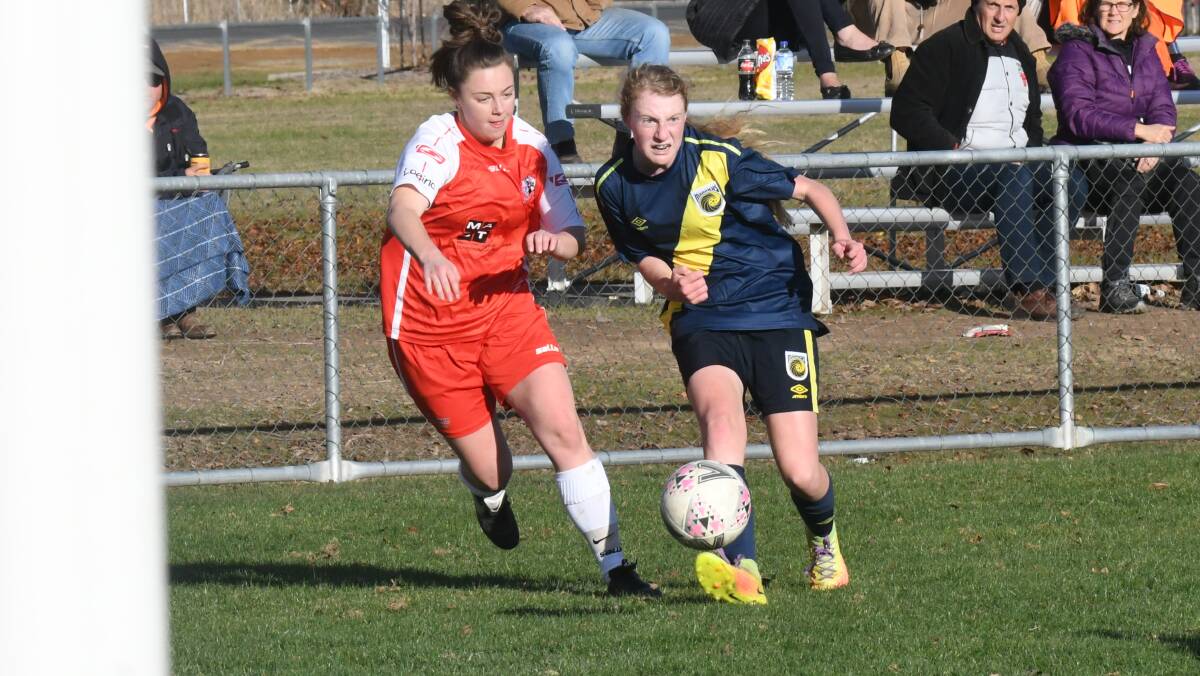 SLOW START: Western NSW Mariners FC's Ginger Oliver sends in a cross during her side's match against St George FC. The visiting St George side were too good for the Mariners in a 3-1 win. Photo: CARLA FREEDMAN