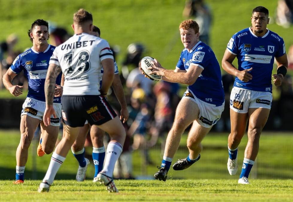 Brad Fearnley takes the ball forward for the Newtown Jets in Saturday's win. Picture by Mario Facchini.