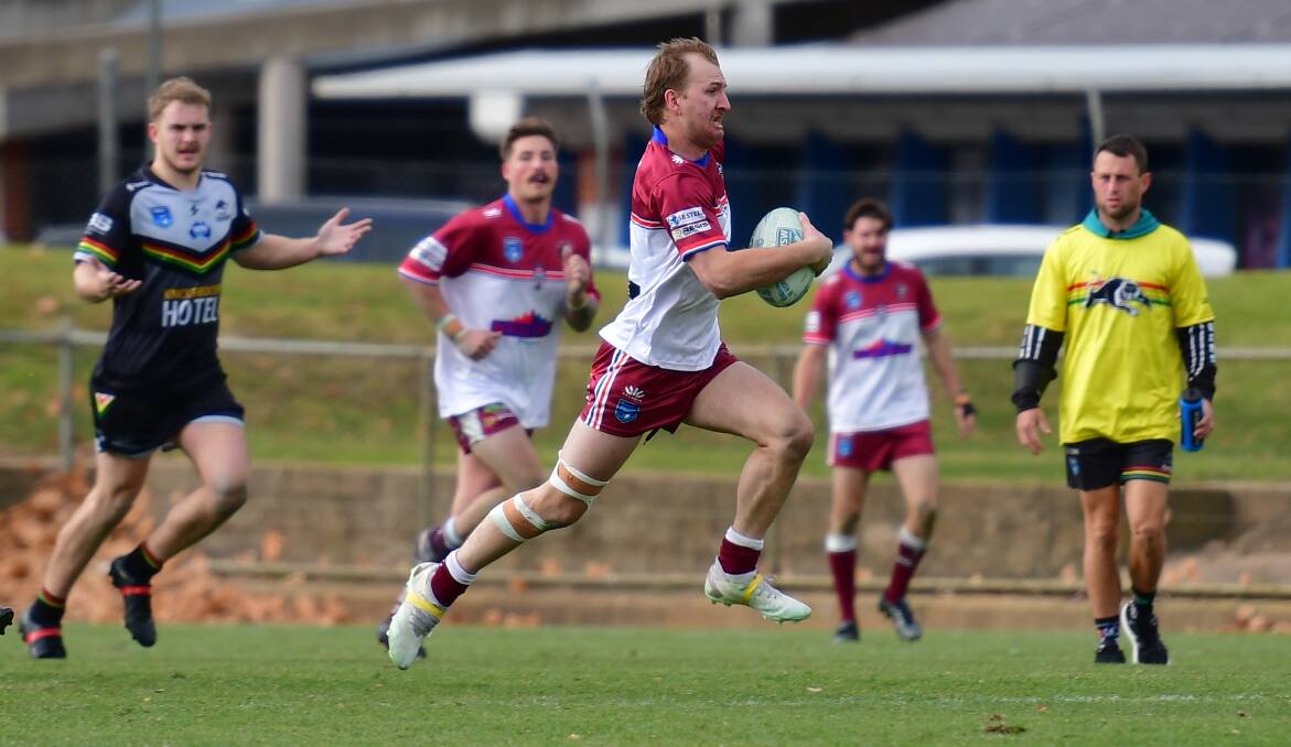 Blayney Bears fullback Will Cramp breaks through the Bathurst Panthers' defensive line to score the last try of the game. Picture by Alexander Grant.