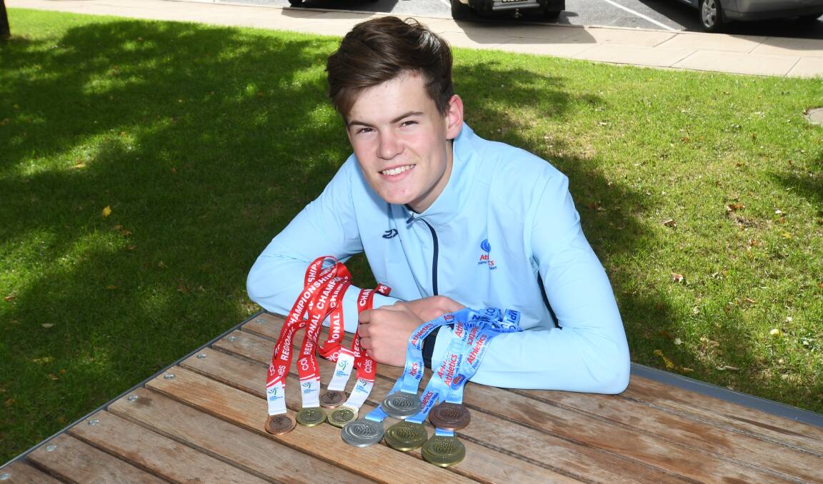 RECOVERY: Evan Smith with his collection of medals. Smith qualified for nationals after finishing third at state level. Photo: CHRIS SEABROOK