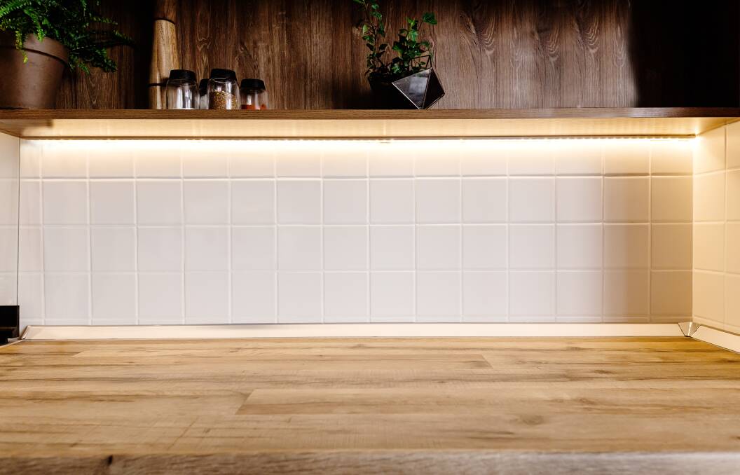 LIGHT UP: If you want to impress potential buyers, installing under-cabinet lighting, such as LED strip lights, will give your kitchen a unique feature. Photo: Shutterstock