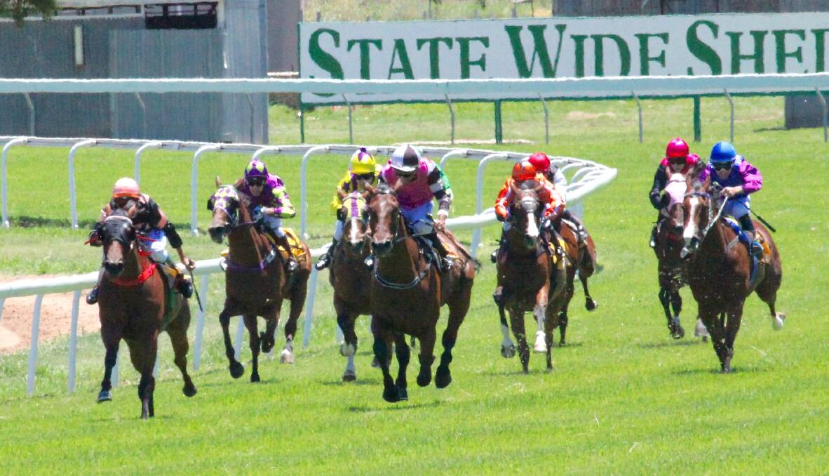 TOO FAST: Gillie Mooch (far left) holds off Kenny Succeed on her way to scoring victory at Wellington. Photo: JO IVEY