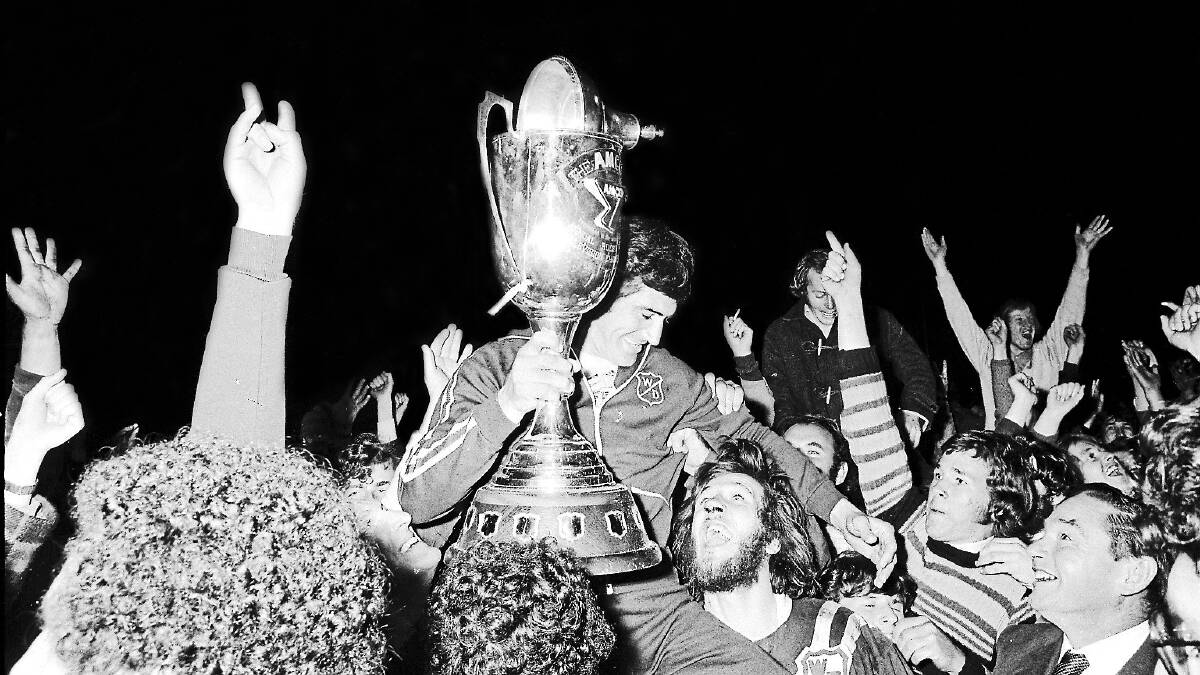 Coach Johnny King celebrates with the Amco Cup after Western Divisions against-the-odds win in 1974. Picture supplied