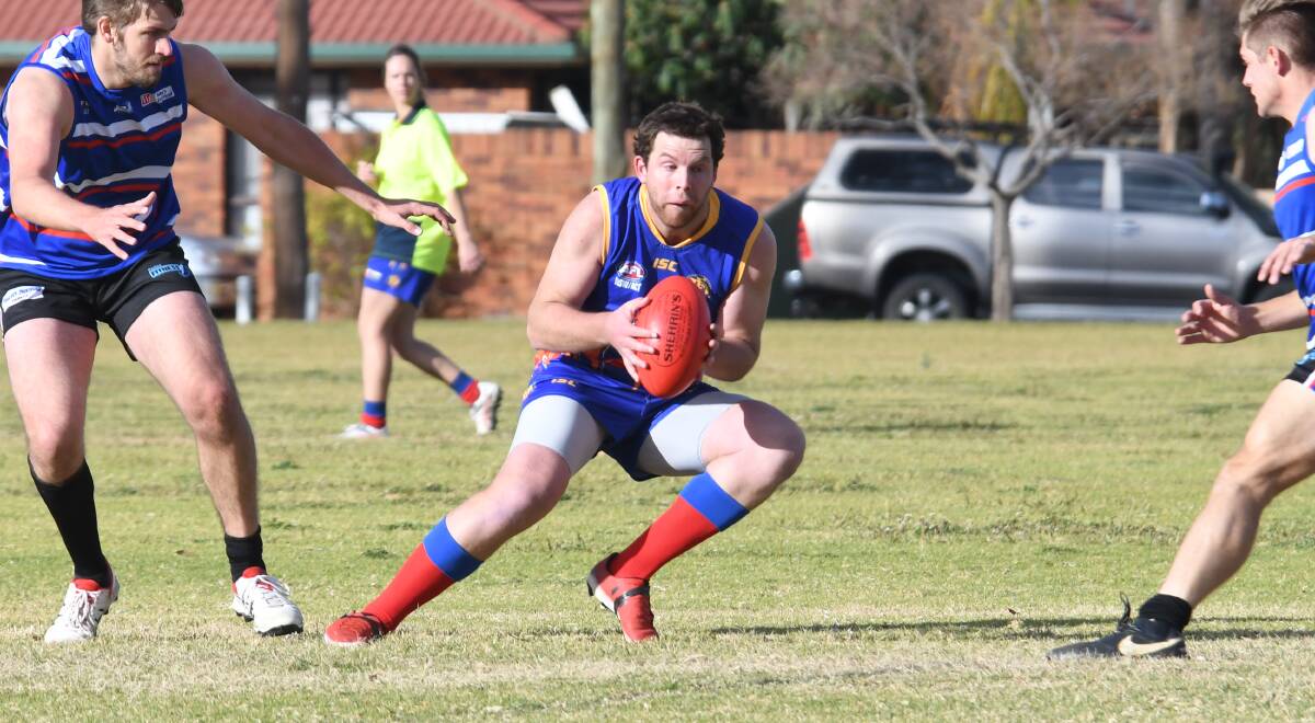 WORKING: Angus Norton and the Dubbo Demons returned to form with a strong win over Parkes on Saturday. Photo: MAY McINTYRE