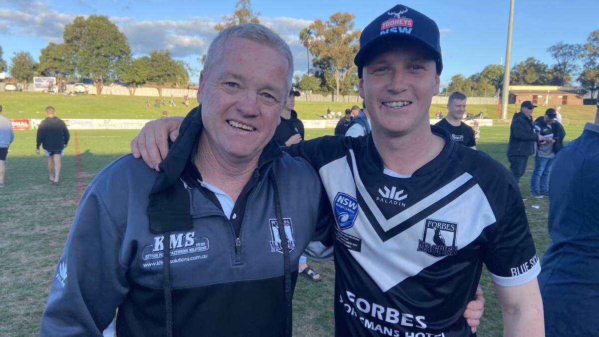 Cameron Greenhalgh, pictured with son Nick after the grand final, led a mighty turnaround for the Forbes Magpies this season. Picture by Nick Guthrie