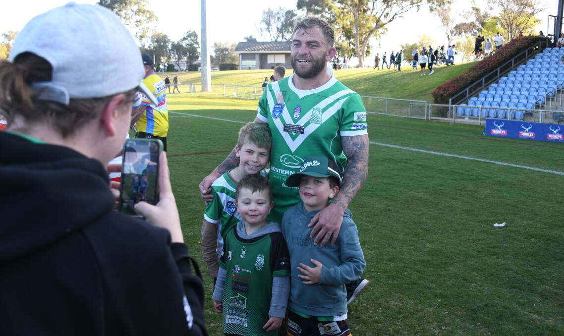 Jyie Chapman with his three sons after winning the 2023 Peter McDonald Premiership grand final. Picture by Amy McIntyre
