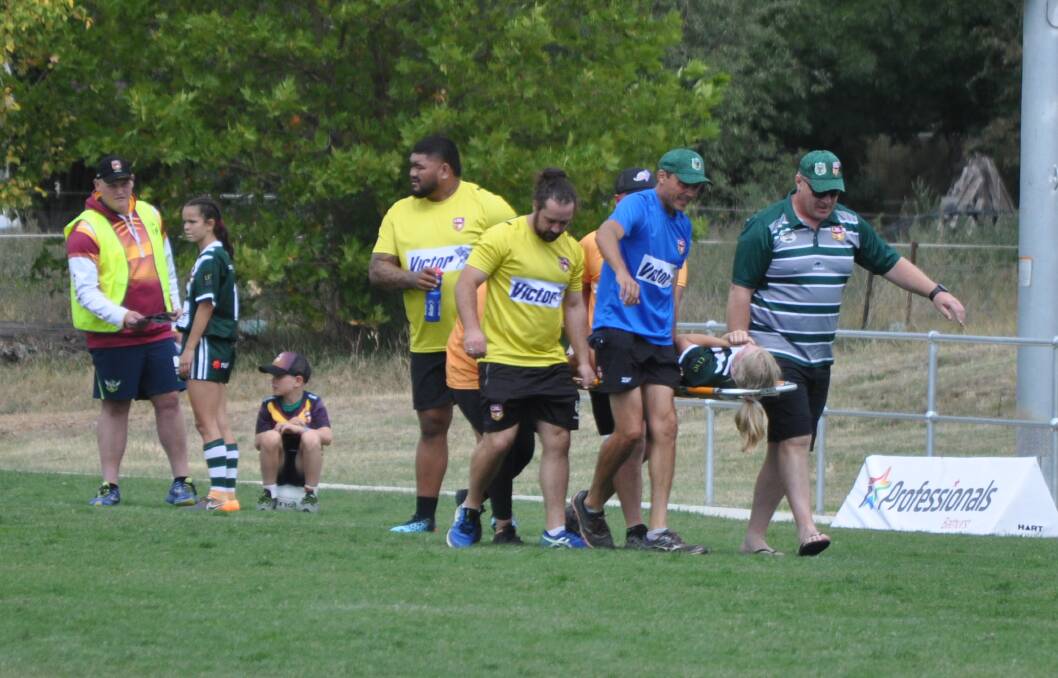 INJURY BLOW: Alahna Ryan is stretchered off after suffering the injury while playing for the Western Rams on Saturday. Photo: NICK McGRATH