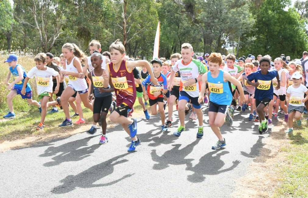 JUNIOR DASH: Competitive kids make a break from the start line last year. Photo: JUDE KEOGH
