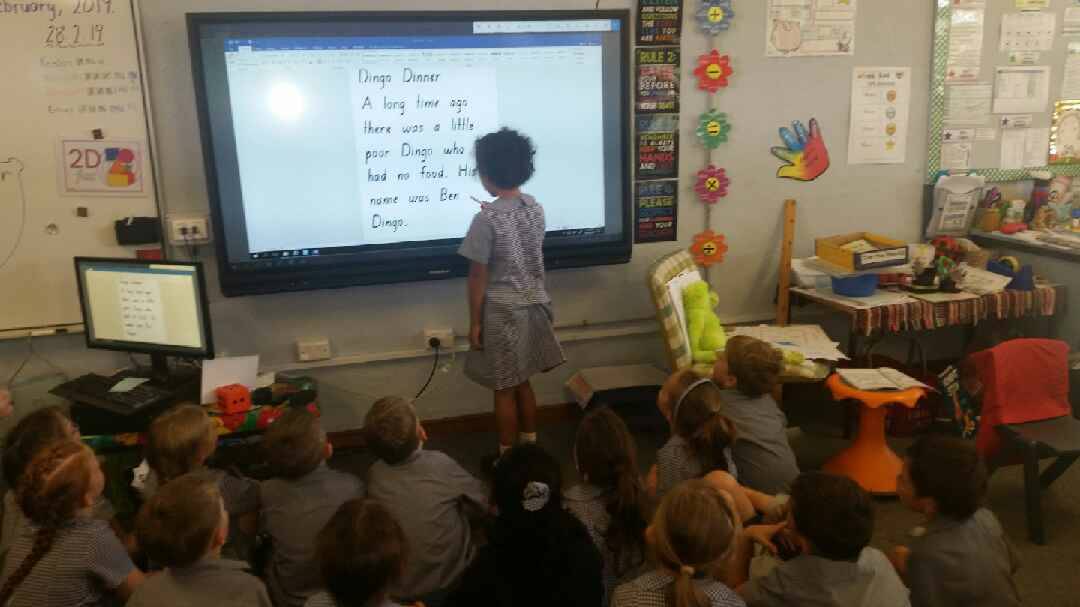DIGITAL LESSON: Students test out the ActivPanel which was installed in January. Photo: supplied.
