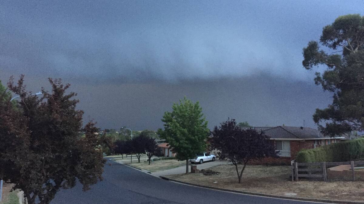 RAIN DUMP: Storm clouds came rolling in over Royle Drive in West Orange on Sunday evening. Photo: NICK MCGRATH