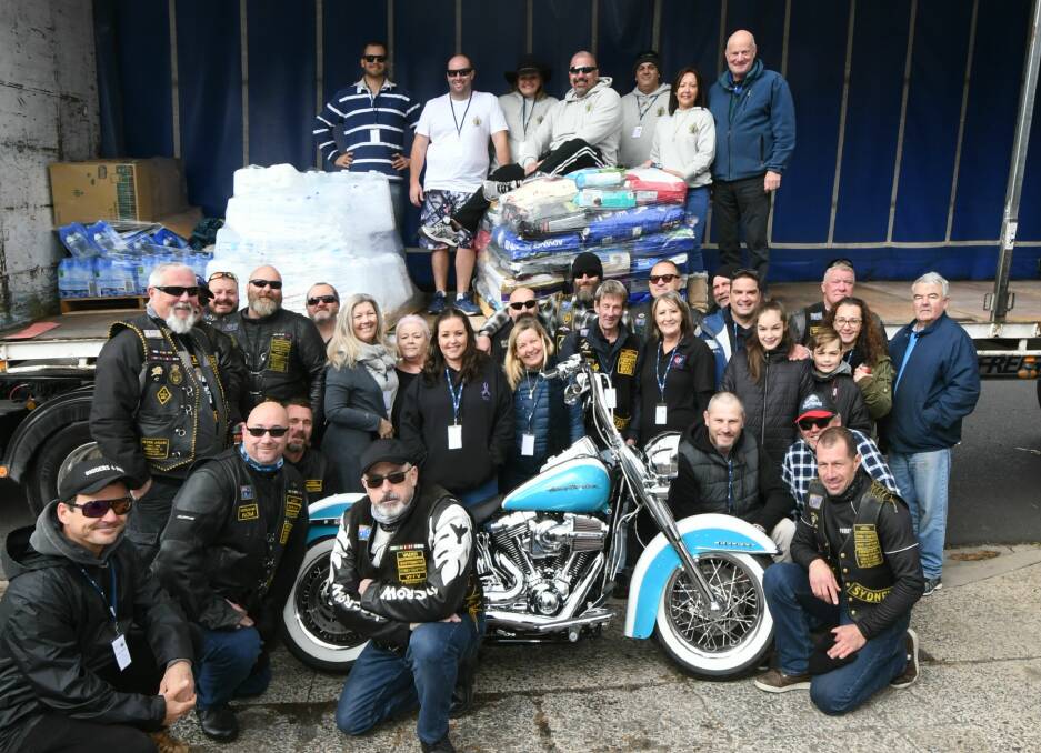 RELIEF BLITZ: The Sutherland Shire Convoy 4 Farmers and the Veterans Motorcycle Club met Pay It Forward on Saturday. Photo: CARLA FREEDMAN 0907cfpayitforward1