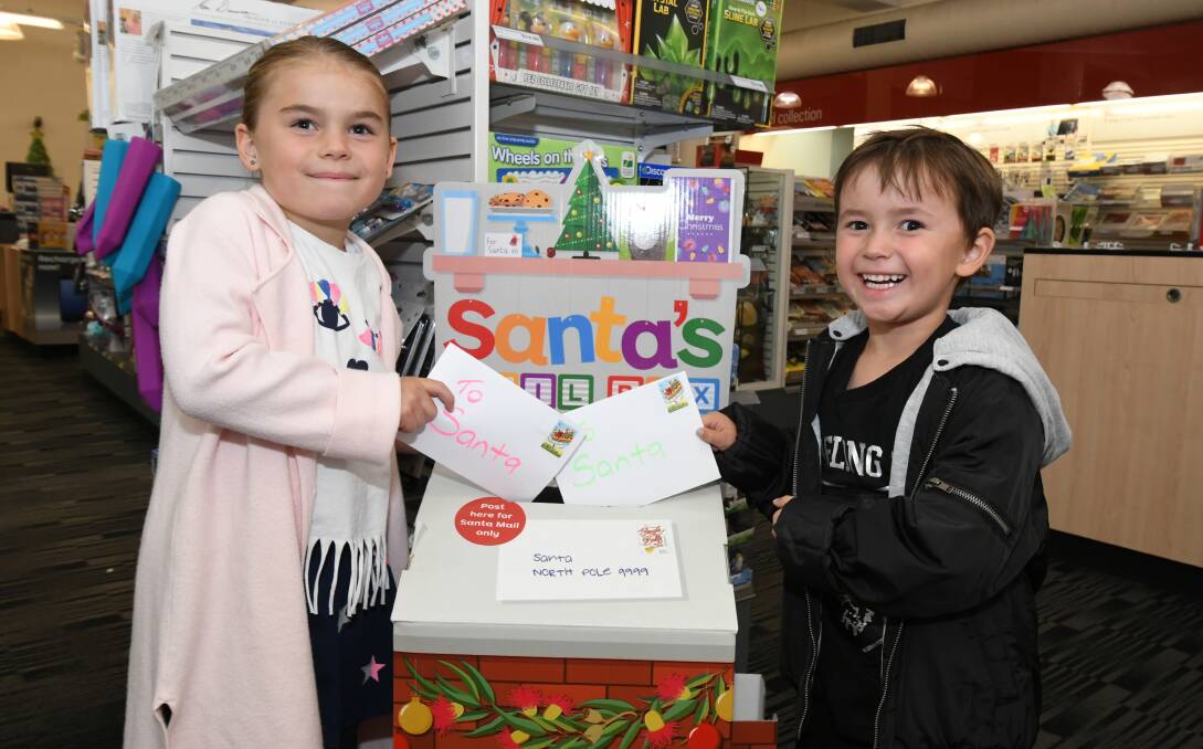 SANTA MAIL: Geri-Lee and Louie Gorham posted their letters to the North Pole. Photo: JUDE KEOGH 2311jksanta