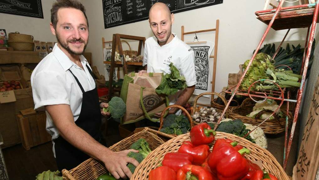 MARKET MASTERS: Enrico Tomelleri and Enrico Sgarbossa will run an Italian cooking workshop at the farmer's market. Photo: JUDE KEOGH 0829jkchef1