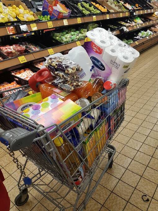 FOOD DONOR: Ray Chamberlain purchased this trolley of groceries for donation.