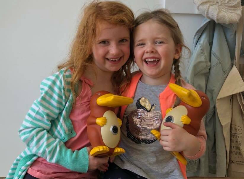 SISTERS SUPPORT: Sylvie and Lenya Miller emptied their piggy banks to donate to a little girl was born with profound hearing loss. Photo: SUPPLIED