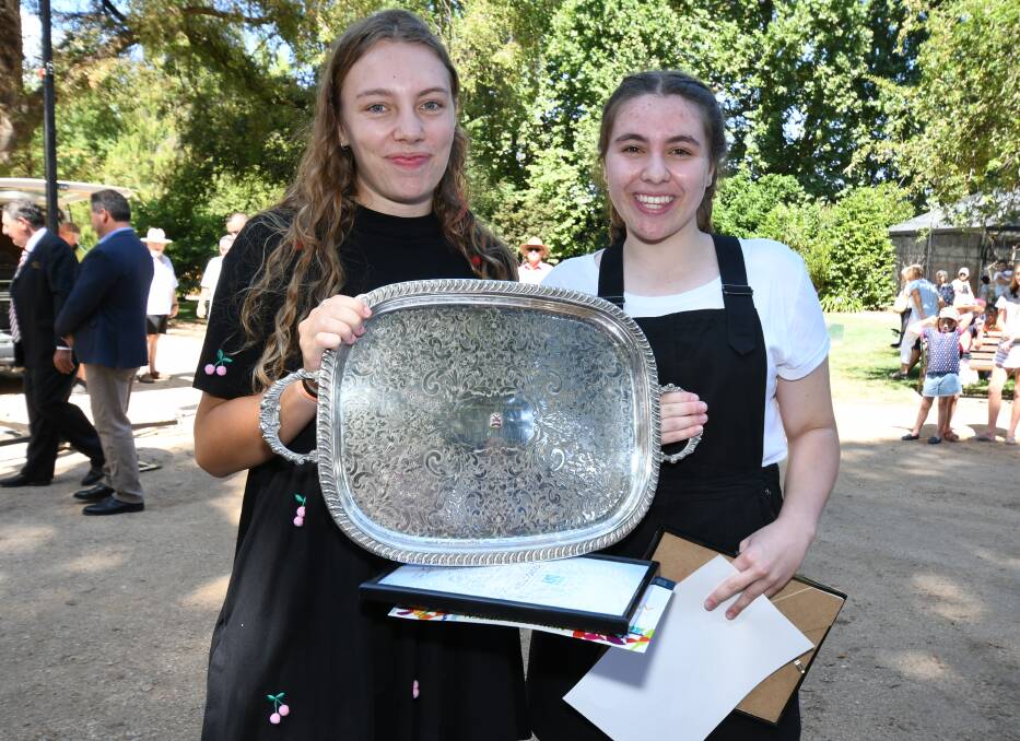 YOUNG GUNS: Ailish and Alanah Seedsman accept the Young Citizen of the Year trophy at the Party in the Park ceremony. Photo: JUDE KEOGH