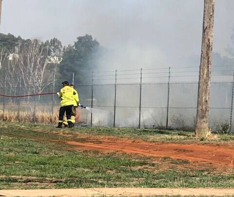 FIRE DANGER: Fire fighters put out a blaze on Cecil Rd on Monday afternoon which caused disruptions to power supplies. Photo: SUPPLIED