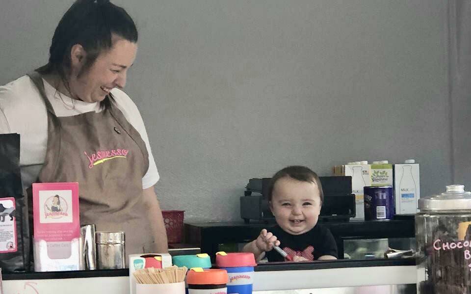 BABY SERVER: Jessica Gough works the coffee cart with Audrey. Photo: supplied.