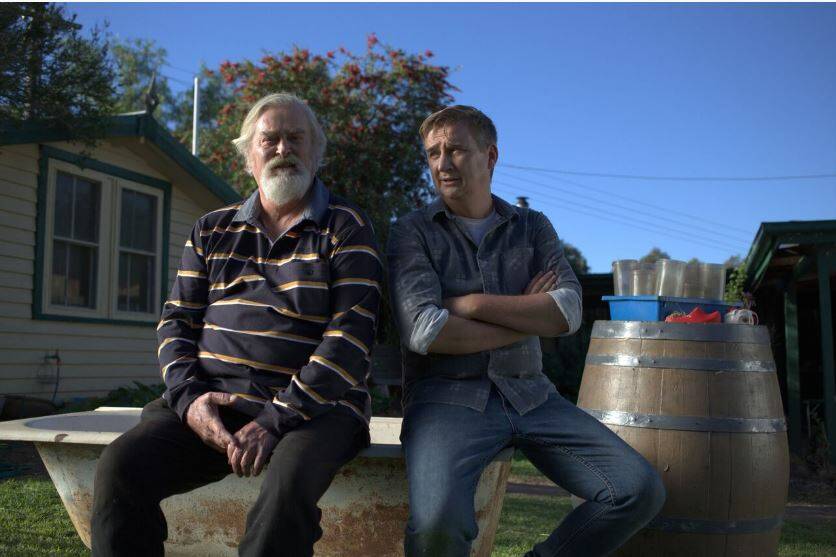 TOWN TROUBLES: John Howard as Bull Barlow and Damian Callinan as Troy Carrington in The Merger. 