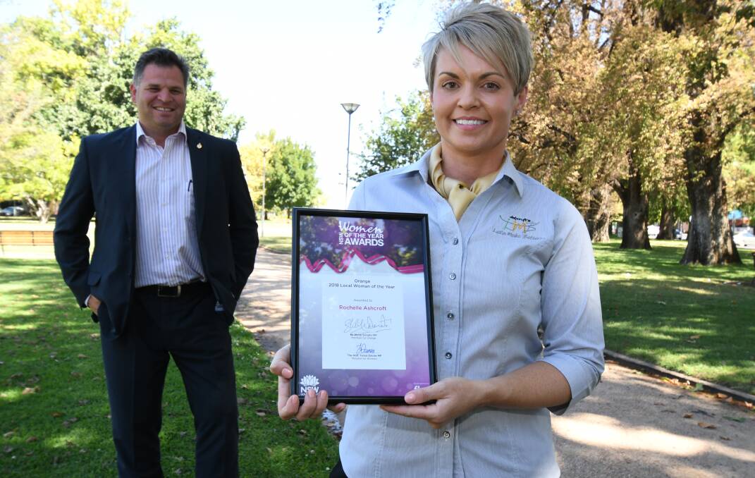 DESERVING WINNER: Member for Orange Philip Donato presents Rochelle Ashcroft with the 2018 Local Woman of the Year Award in Robertson Park. Photo: JUDE KEOGH 0301jkwoman5