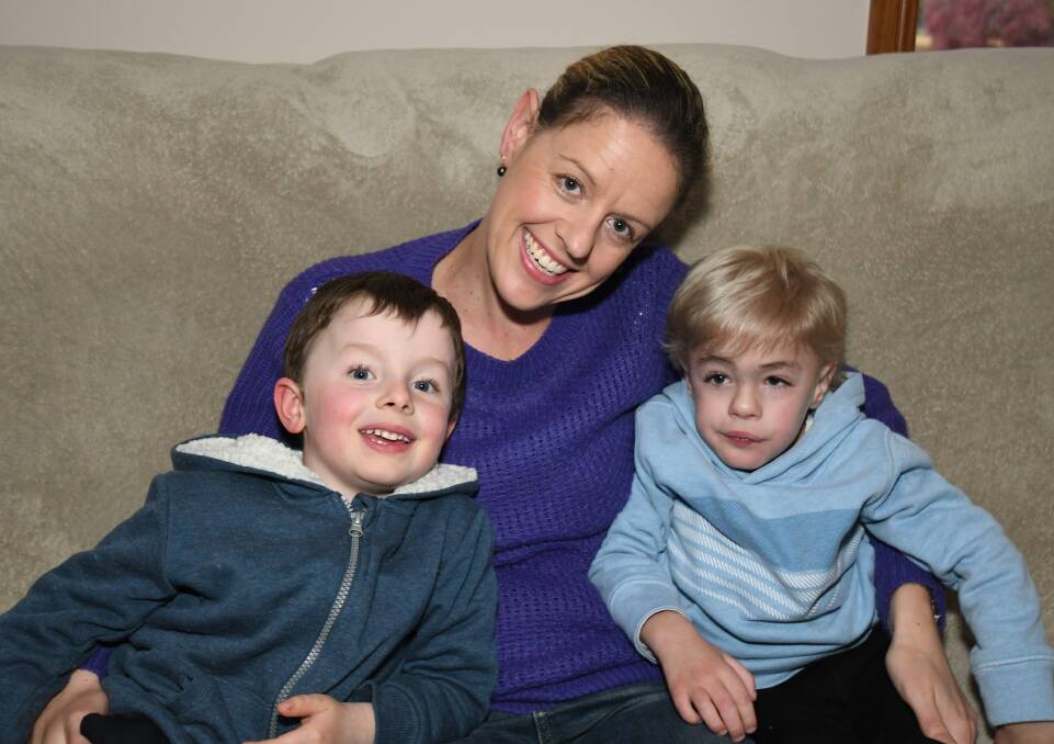 DETERMINED: Dominic and Rohanne Tiefel with their brother and son Lucas Tiefel, who was diagnosed with Sanfilippo Syndrome in 2017. Photo: CARLA FREEDMAN 0610cflucas4