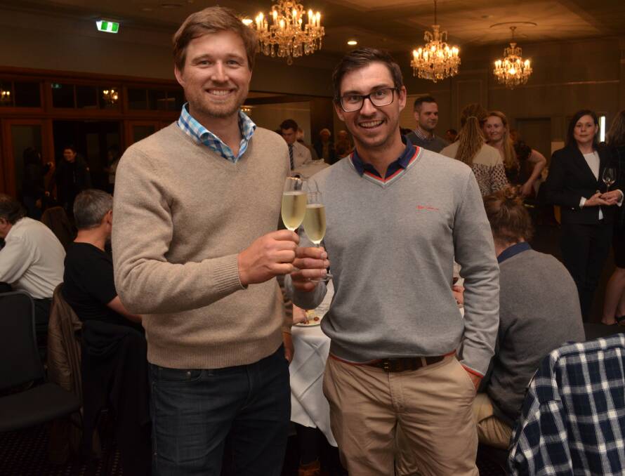 CHIN-CHIN: Brothers Ed and Dave Swift celebrate at The Canobolas Hotel on Friday following their Best Wine of Show win. Photo: ALEX CROWE 