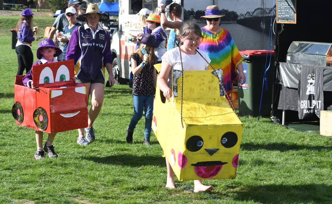 MARCH TOGETHER: The Cancer Council's Relay For Life sees residents walk laps overnight to signify cancer never rests. Photo: JUDE KEOGH
