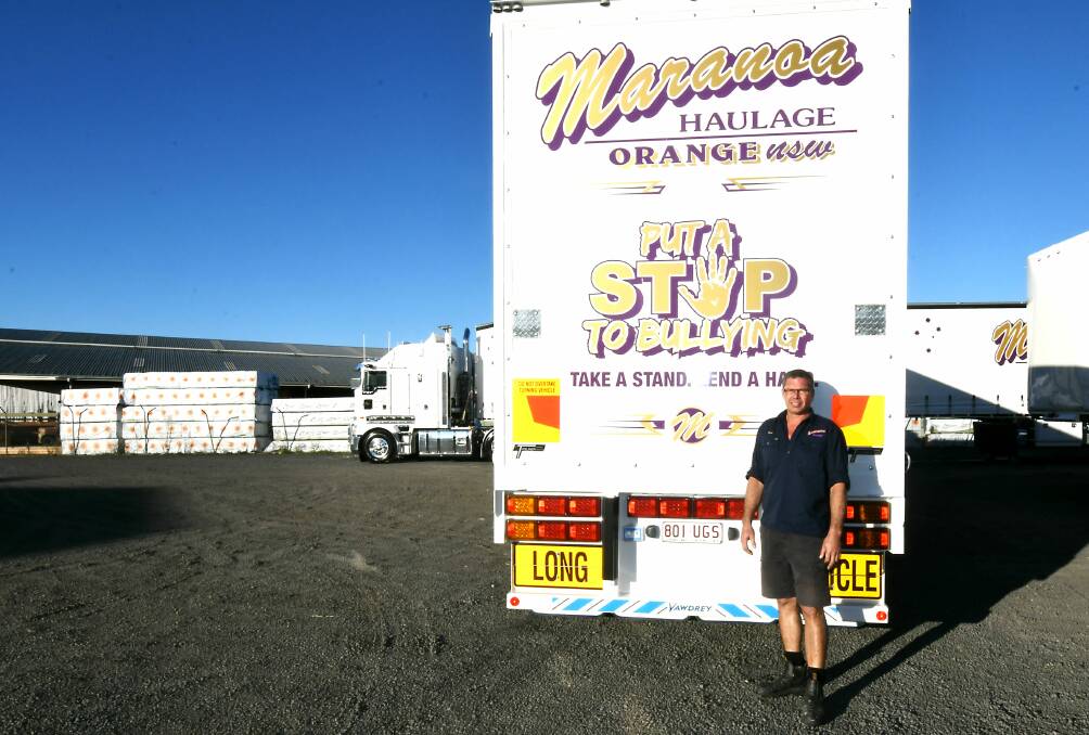 STOP BULLYING: Driver Dean Klaare with one of the trailers from Orange making a statement all over the country. Photo: CARLA FREEDMAN 0624cfmaranoa4