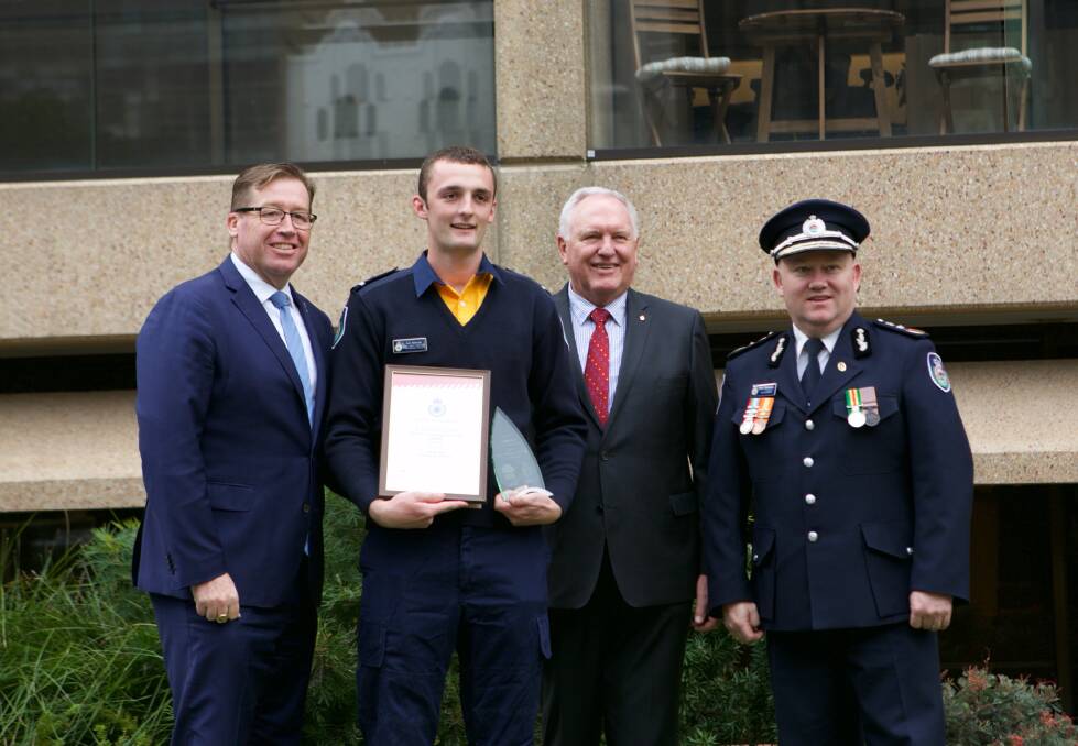 AWARD WINNER: Minister for Emergency Services' Troy Grant, Rural Fire Service (RFS) North West Orange Brigade's Ash Morrow and Member of the Legislative Council's Rick Colless with Commissioner of the RFS Shane Fitzsimmons.