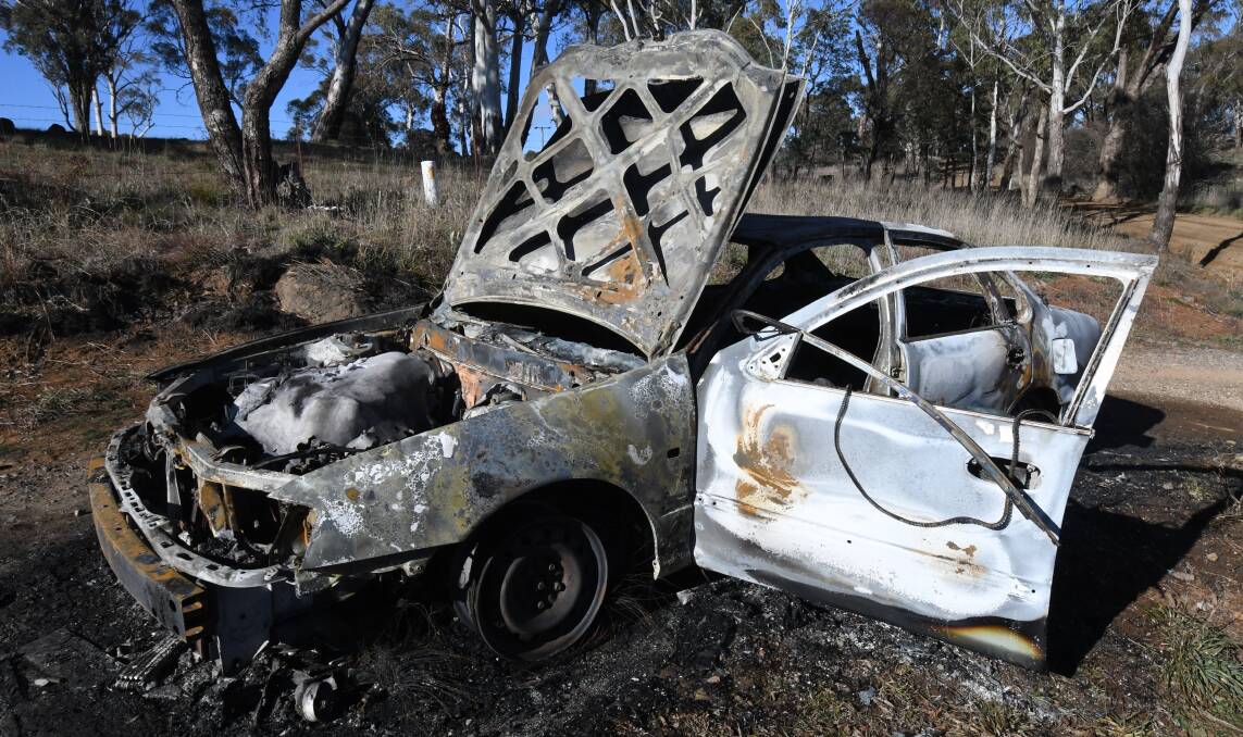 CAR CRIME: A sedan was extinguished at Gosling Creek Reserve in the early hours of Thursday. Photo: JUDE KEOGH