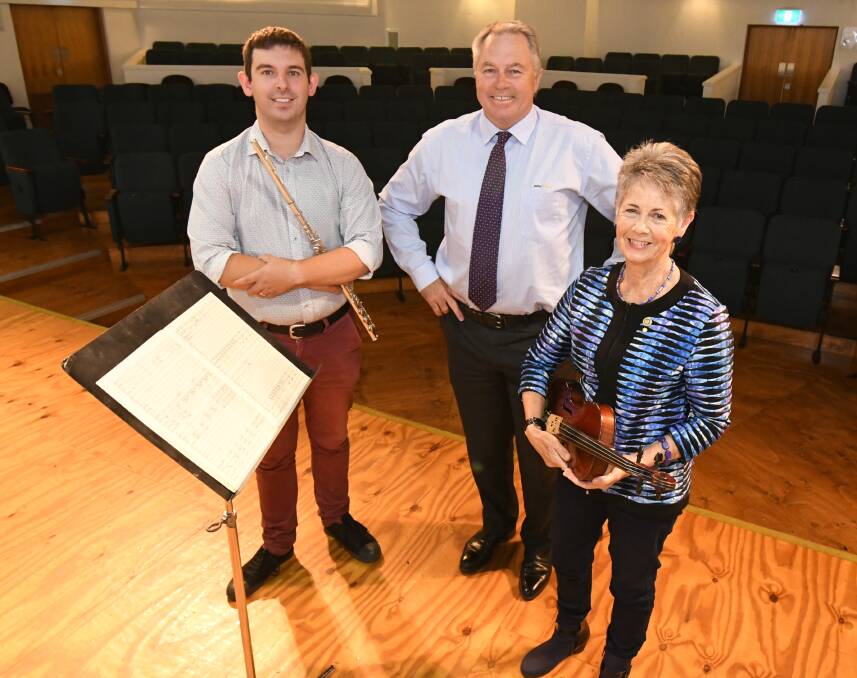 SINGING PRAISE: Orange Symphony Orchestra President Robin Thompson and manager David Shaw thank Peter Fisher Real Estate's Hunter Ridley for the donation.
