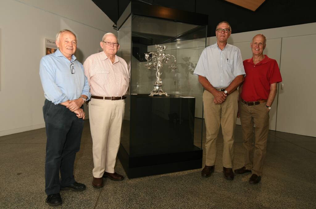 GALLANT CONDUCT: Phillip Schwebel, Ian McIvor, Garry West and Neil Jones with the Campbell Epergne which was awarded for bravery repelling a bushranger and is now on display at the museum. Photo: CARLA FREEDMAN