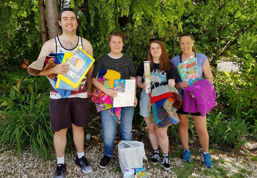 GEARED UP: Sam Mackie, Nick Vidler, Sophia Manca and Chloe Lynch have books, blankets and teachers aids to give away. Photo: supplied.